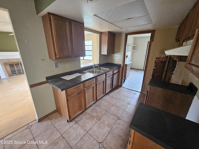 kitchen featuring sink and light tile patterned floors