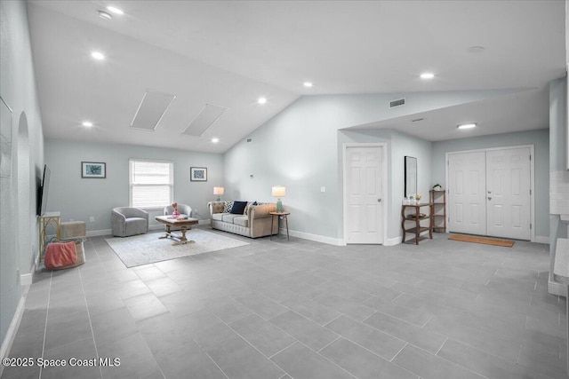 living room featuring lofted ceiling