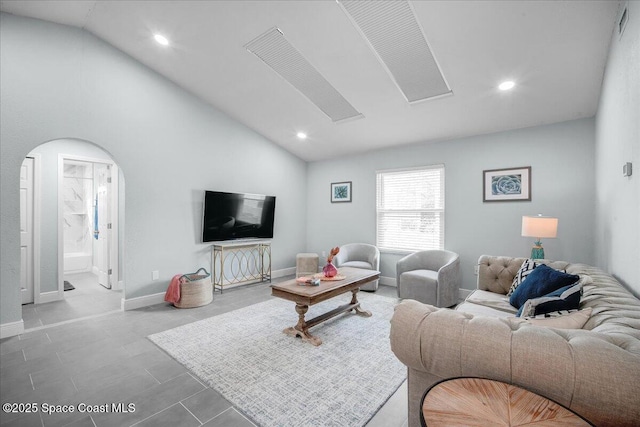 living room with high vaulted ceiling