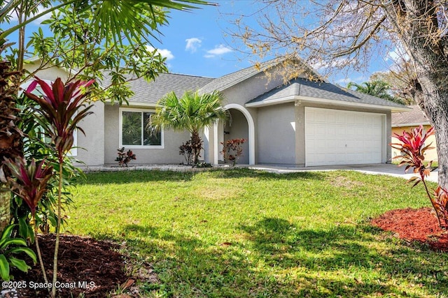 single story home with a garage and a front yard