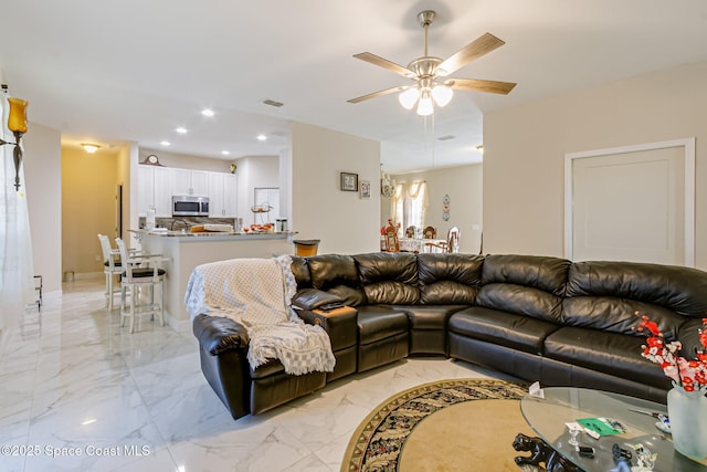 living room with ceiling fan