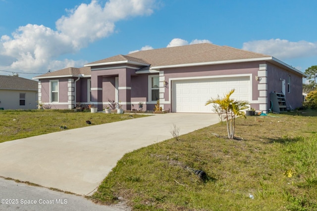 view of front of property with a garage and a front yard