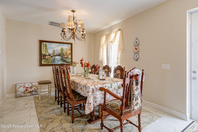 dining space with a chandelier