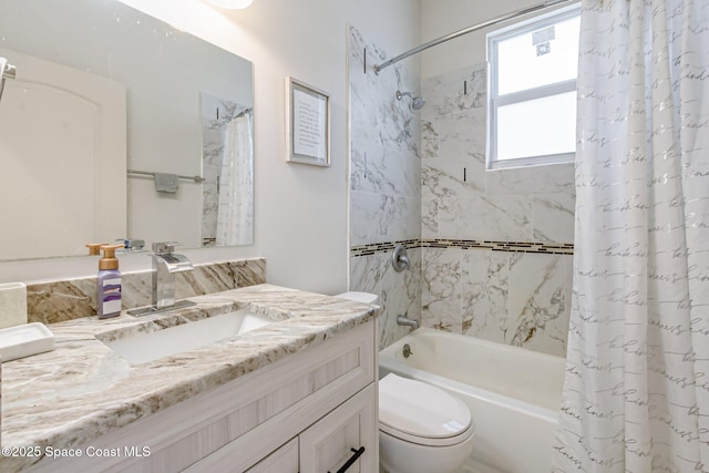 full bathroom with vanity, shower / bath combination with curtain, and toilet