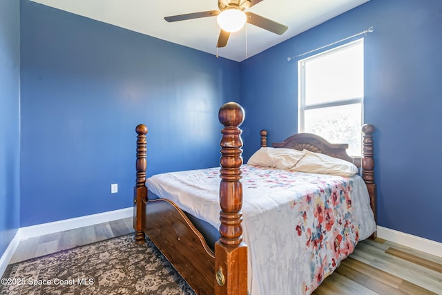 bedroom with ceiling fan and light hardwood / wood-style flooring