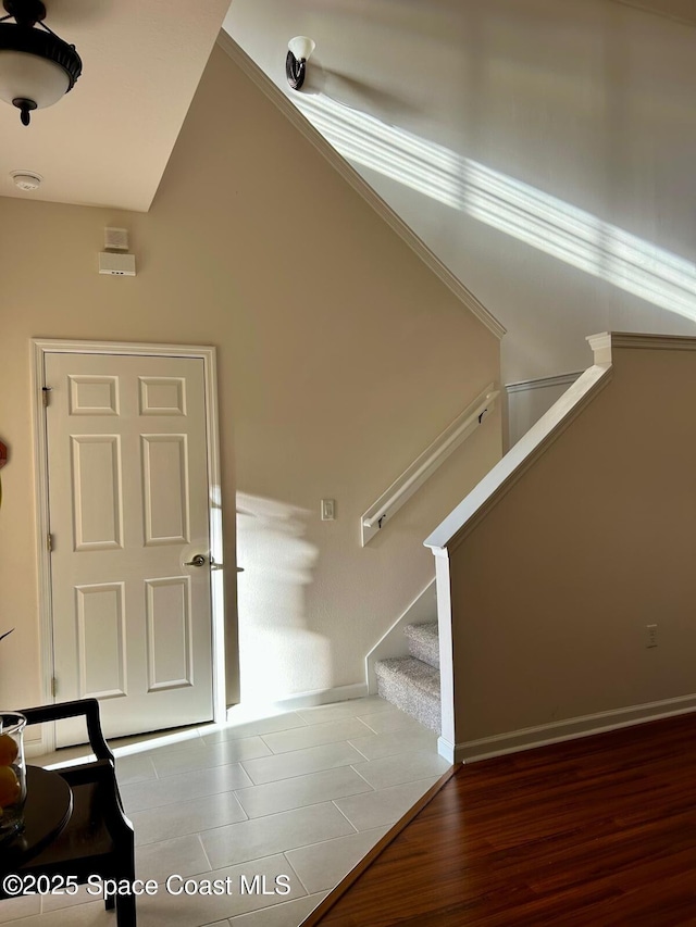 staircase with wood-type flooring