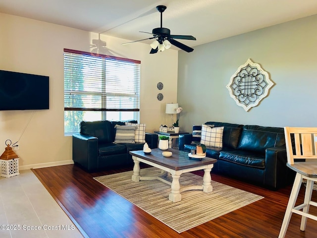 living room with hardwood / wood-style floors and ceiling fan