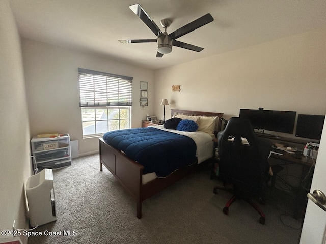 bedroom featuring ceiling fan and carpet