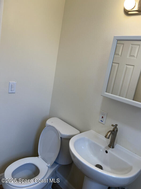 bathroom with toilet and sink