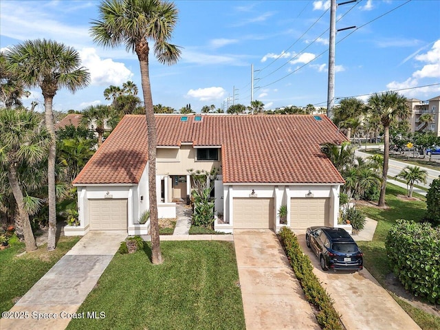 mediterranean / spanish-style home featuring a front lawn