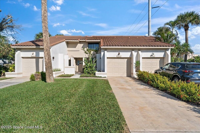 mediterranean / spanish house with a garage and a front lawn