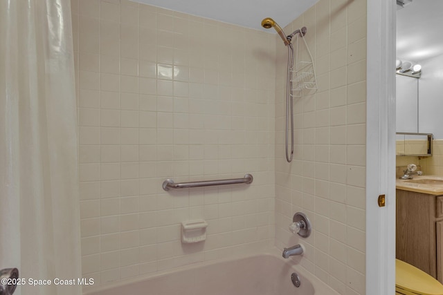 bathroom featuring vanity and shower / bath combination with curtain