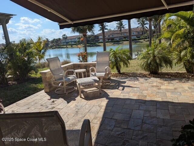 view of patio featuring a water view