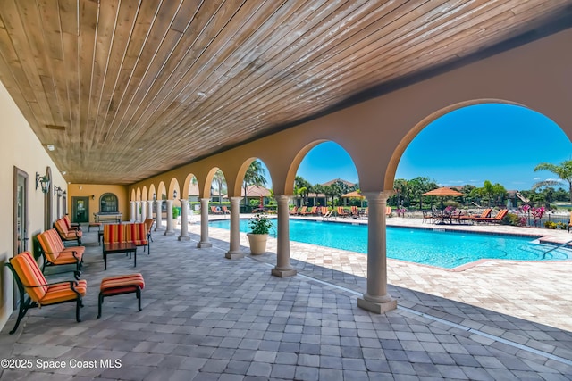 view of swimming pool featuring a patio area