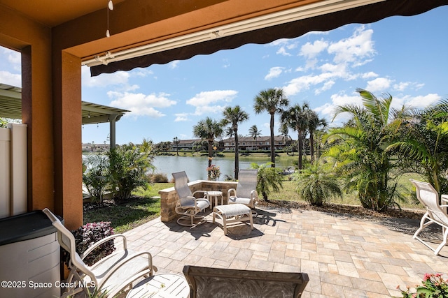 view of patio featuring a water view