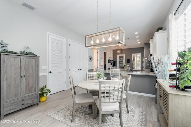 dining room featuring light hardwood / wood-style floors