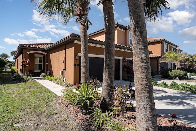 view of property exterior with a yard and a garage