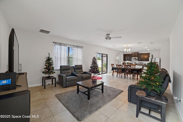 tiled living room with ceiling fan