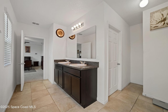 bathroom with vanity and tile patterned floors