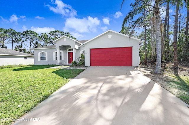 view of front of house featuring a garage and a front yard