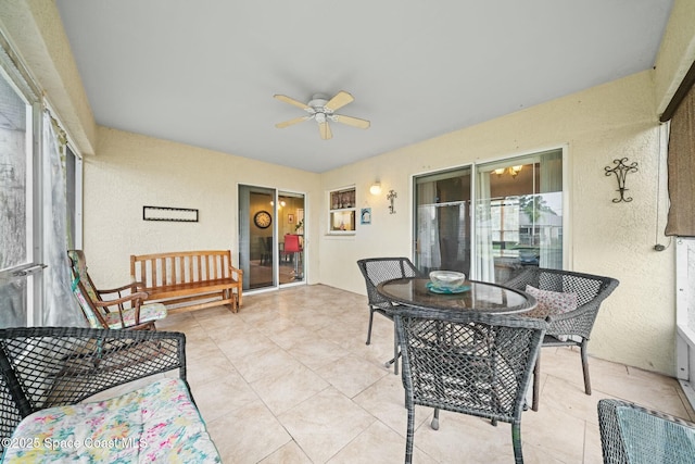 sunroom with ceiling fan