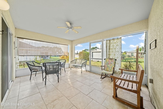 sunroom / solarium with ceiling fan