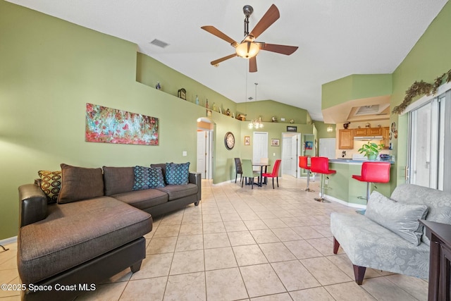 living room with ceiling fan, high vaulted ceiling, and light tile patterned floors