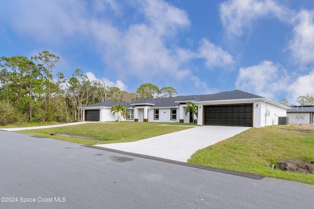 view of front facade featuring a garage and a front yard