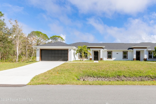 view of front facade featuring a garage and a front yard