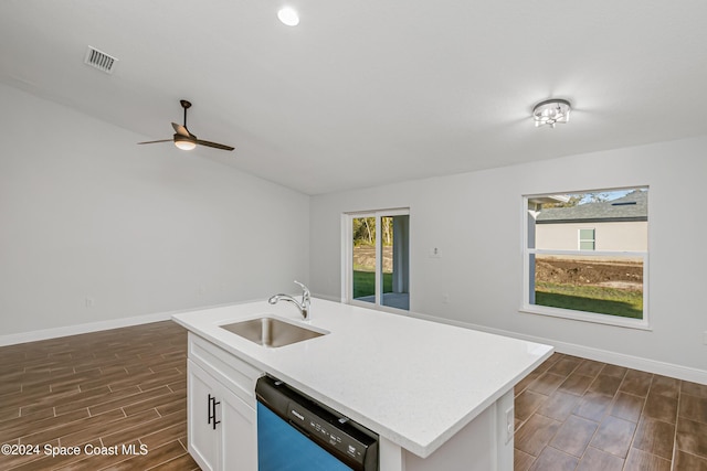 kitchen featuring sink, white cabinetry, dishwasher, ceiling fan, and a kitchen island with sink