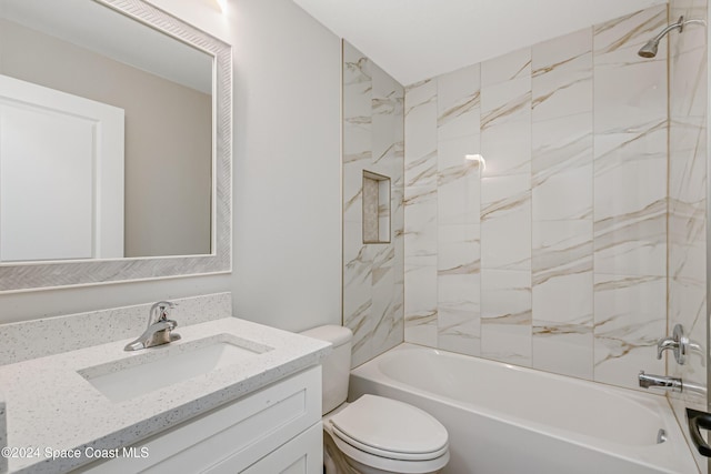 full bathroom featuring vanity, toilet, and tiled shower / bath