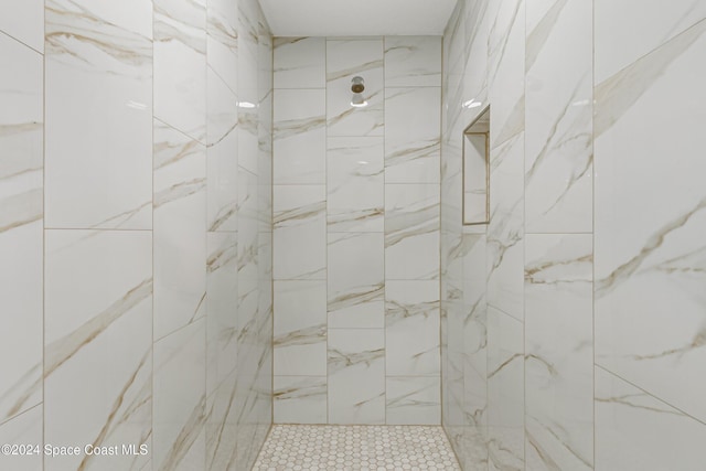 bathroom with tiled shower