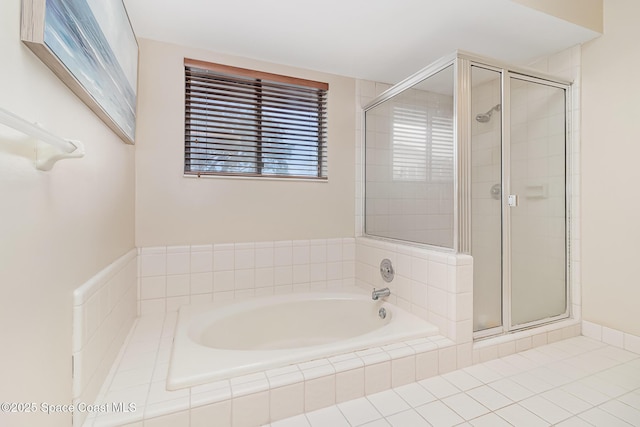 bathroom featuring shower with separate bathtub