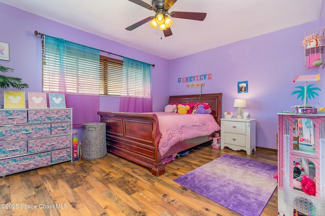 bedroom featuring hardwood / wood-style flooring and ceiling fan