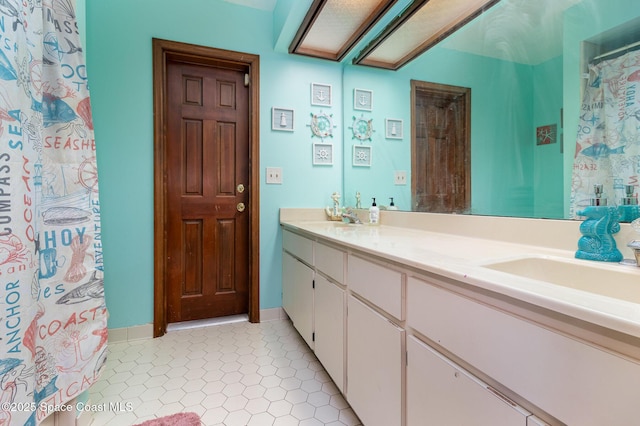 bathroom with vanity and tile patterned floors