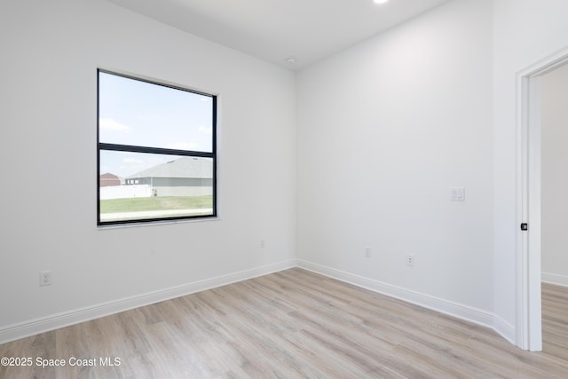 spare room featuring light hardwood / wood-style floors