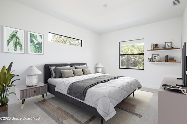 bedroom with light colored carpet