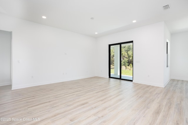 empty room with light wood-type flooring