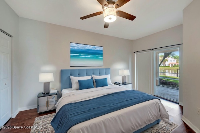 bedroom featuring hardwood / wood-style floors, access to outside, and ceiling fan