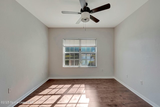 spare room featuring ceiling fan and dark hardwood / wood-style flooring