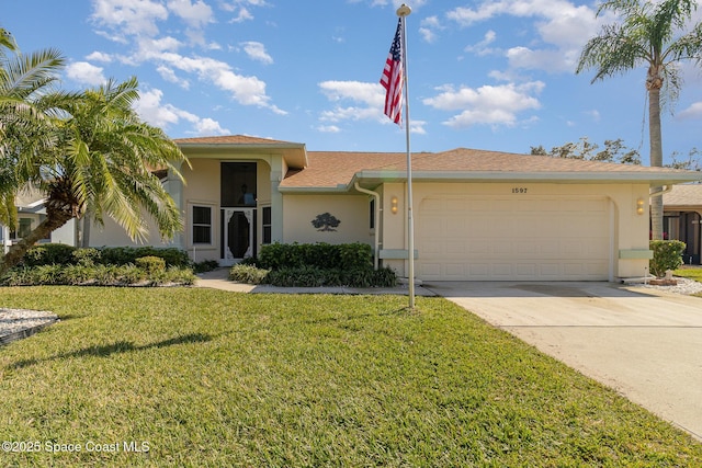 view of front of property featuring a garage and a front yard