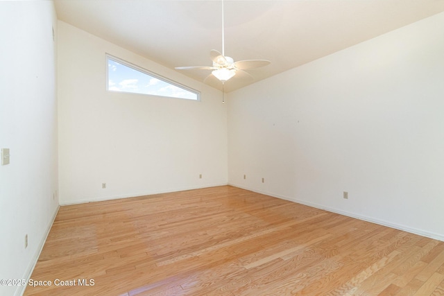 unfurnished room featuring ceiling fan, lofted ceiling, and light hardwood / wood-style flooring