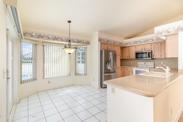 kitchen with sink, appliances with stainless steel finishes, hanging light fixtures, kitchen peninsula, and light brown cabinets