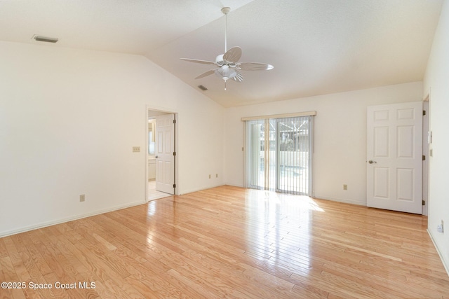 spare room with ceiling fan, lofted ceiling, and light hardwood / wood-style floors