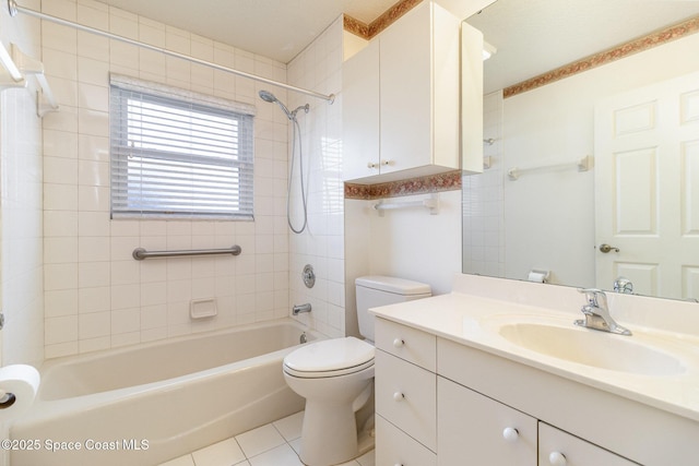 full bathroom featuring tiled shower / bath, vanity, toilet, and tile patterned flooring