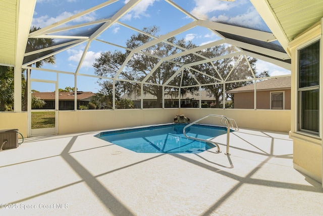 view of pool featuring a lanai and a patio area