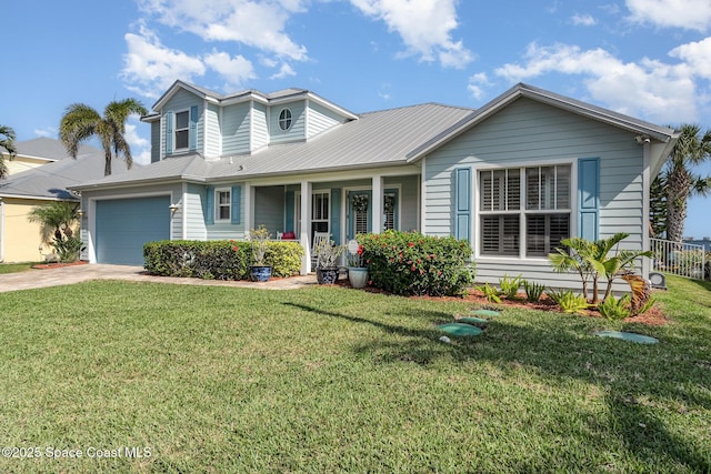 view of front of house featuring a garage, a front yard, and a porch