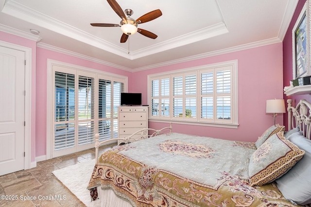 bedroom with a tray ceiling, access to outside, ornamental molding, and ceiling fan