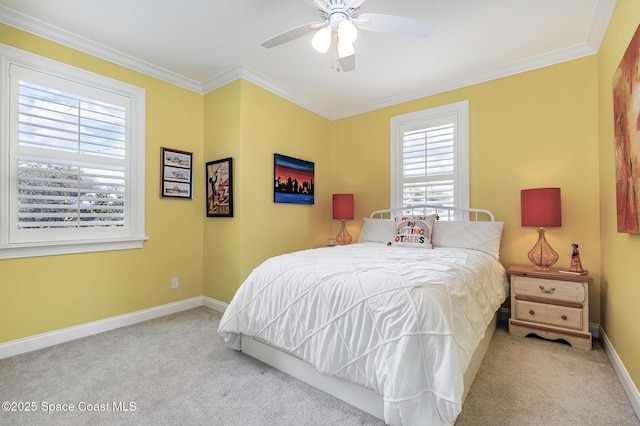 bedroom featuring crown molding, light carpet, and ceiling fan