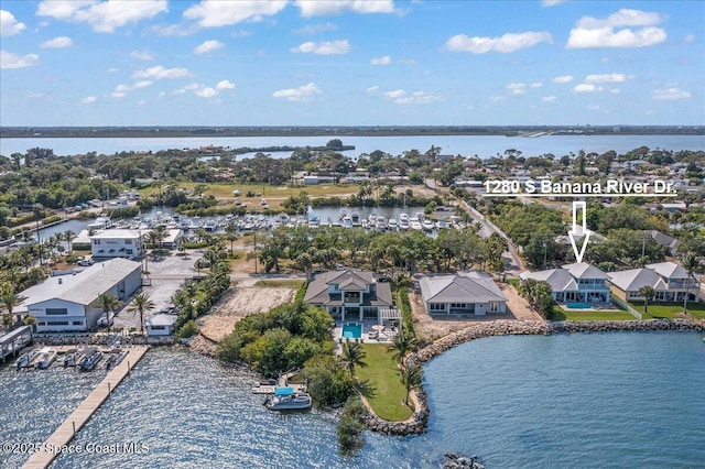 birds eye view of property with a water view